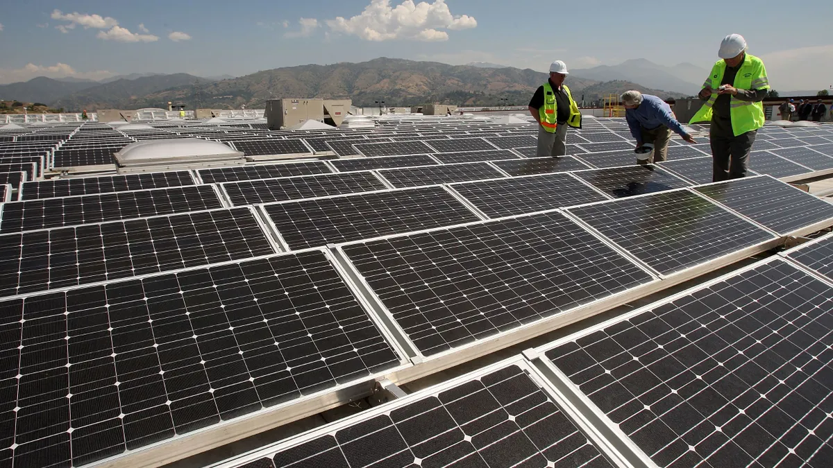Solar panels cover the roof of a Sam's Club store.