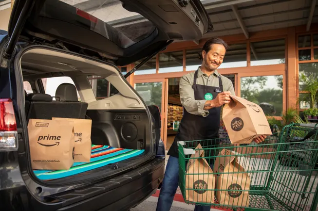 Amazon invests over $230M in benefits, pay for Whole Foods store employees