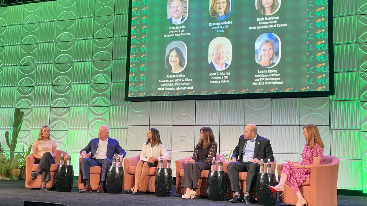 Hotel executives speak on stage at 2025's Lodging Conference.