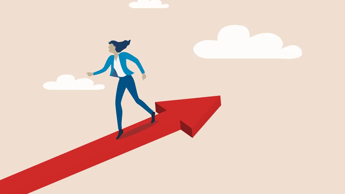 Businesswoman walking in the opposite direction of the arrow