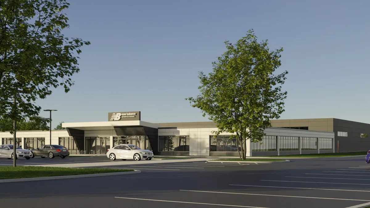 A rendering of a white and dark building with small New Balance logo sign on the top, surrounded by a parking lot.