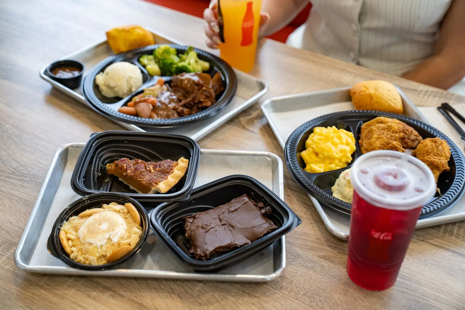 A photograph of various food items in trays