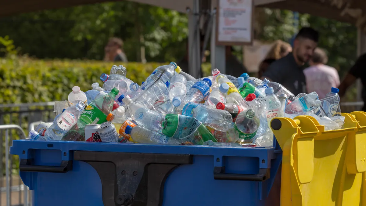 Container filled with collected empty PET bottles, cans and plastic cups at Tomorrowland Festival 2019