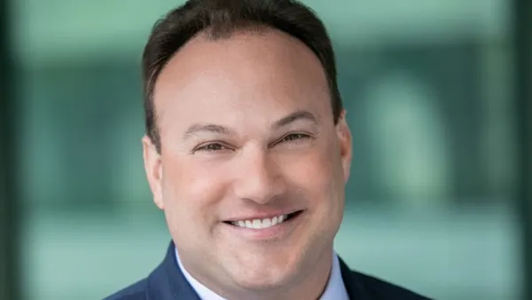 BD CFO Chris DelOrefice wears a suit and tie in a headshot.