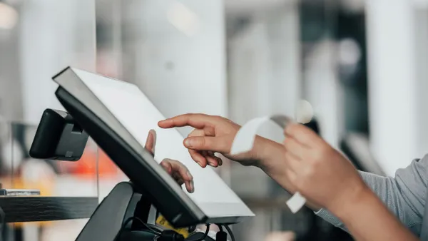 Close up of salesperson hands accounting, billing some goods for sale, finance concept.