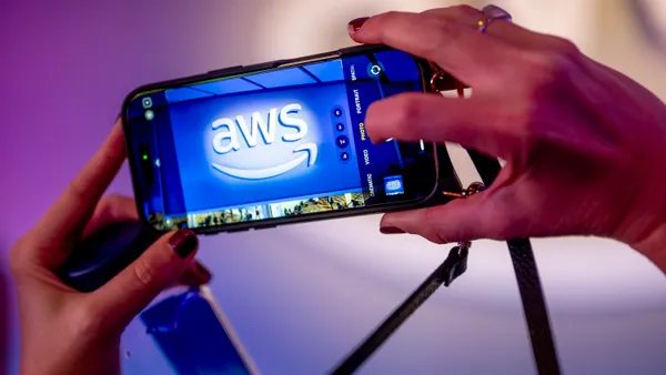 The AWS logo pictured on a smartphone at The Venetian Convention & Expo Center on Dec. 2, 2025 in Las Vegas.