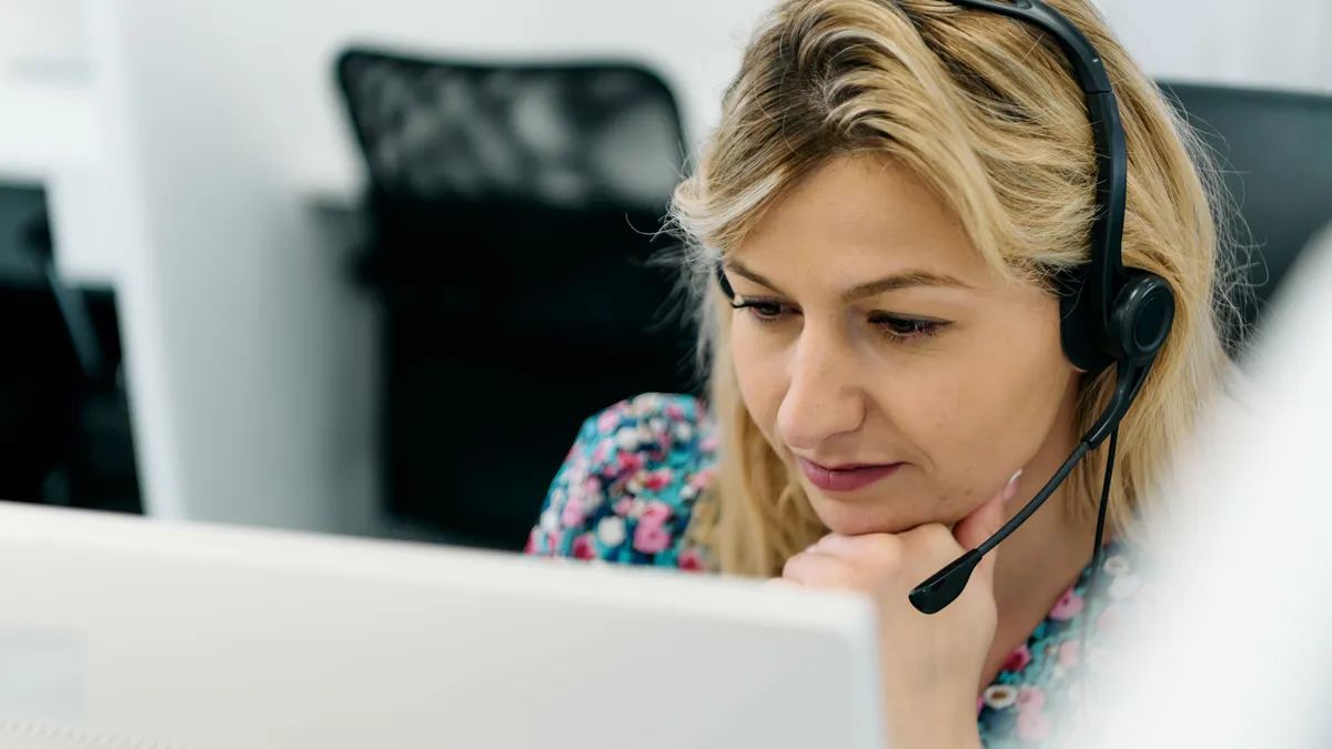 Call center agent answering incoming calls with a headseat.