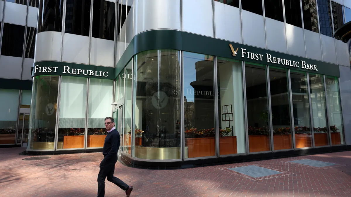 A person walks by a First Republic Bank office on March 16, 2023 in San Francisco, California.