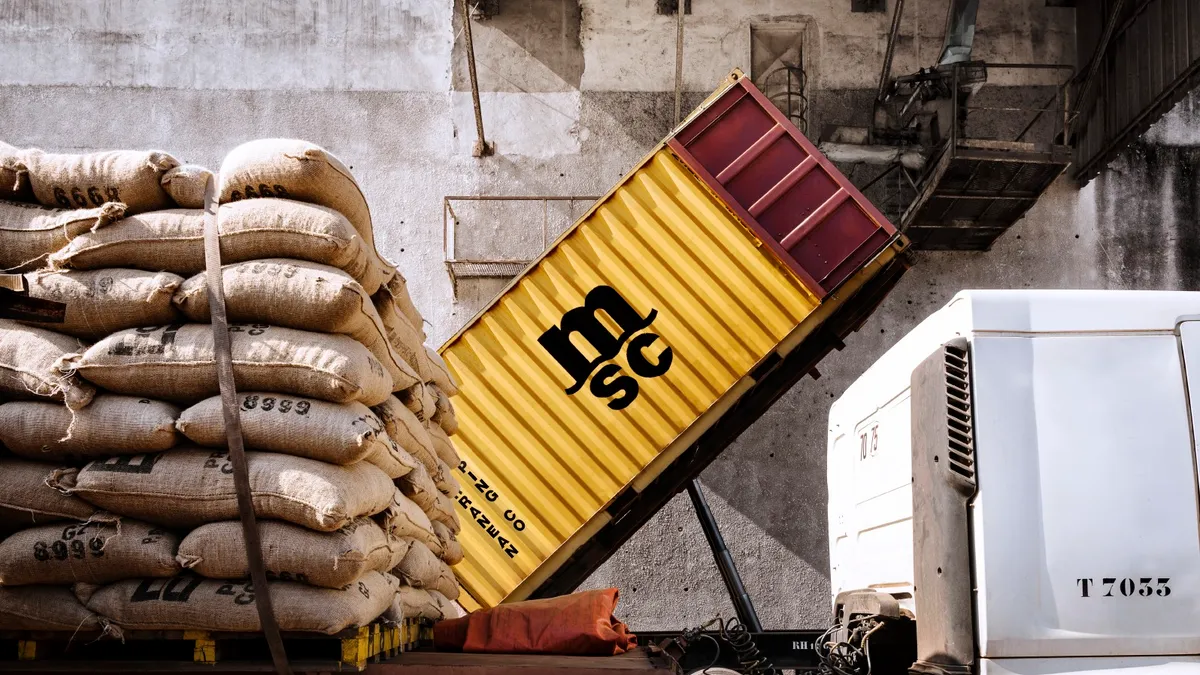 A container being stuffed with cargo.