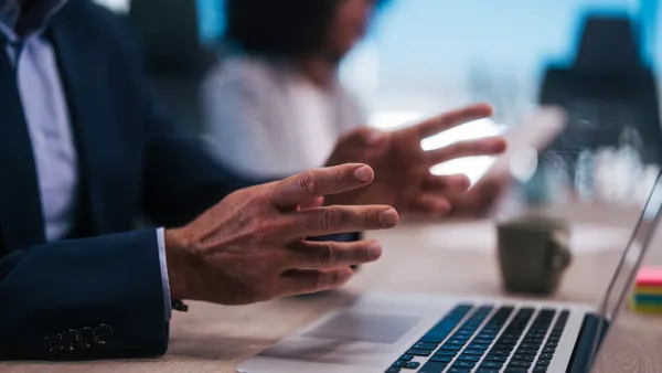 A close up of an executive gesturing