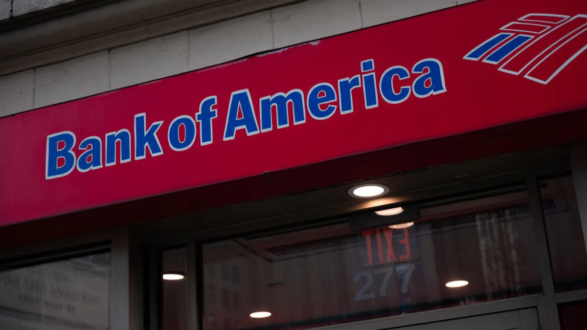 A red sign reads "Bank of America" with the bank's flag logo next to it.