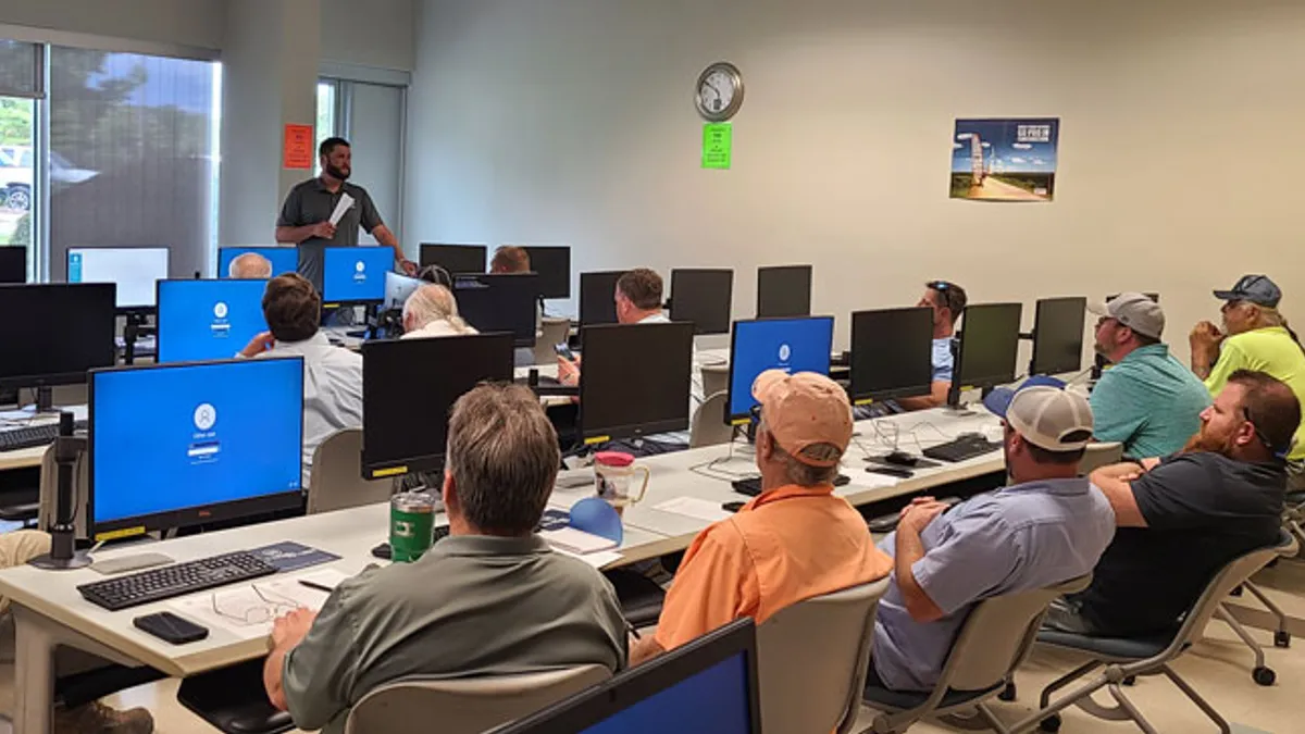 Group of employees listening to a presentation.