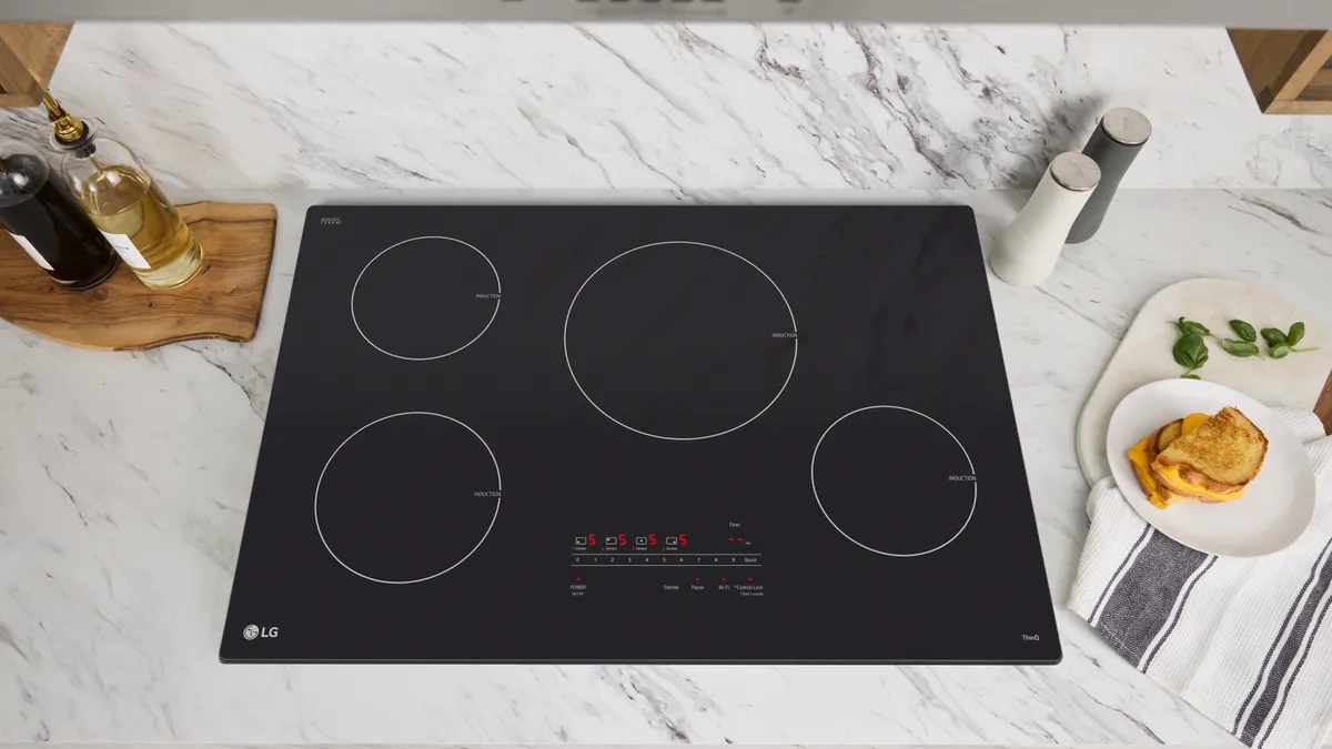 A black cooktop on a white countertop.