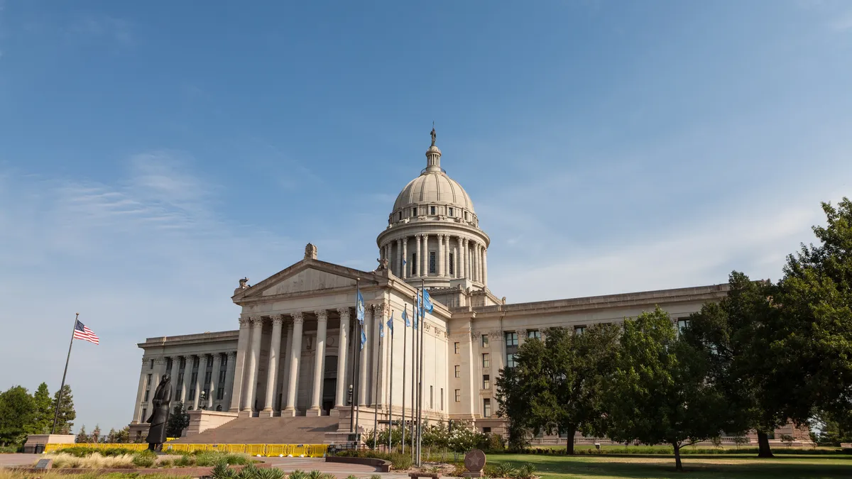 The Oklahoma state capitol is pictured against a blue sky