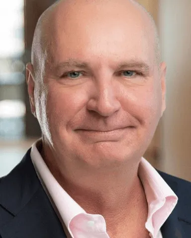 Headshot of a man in business attire.
