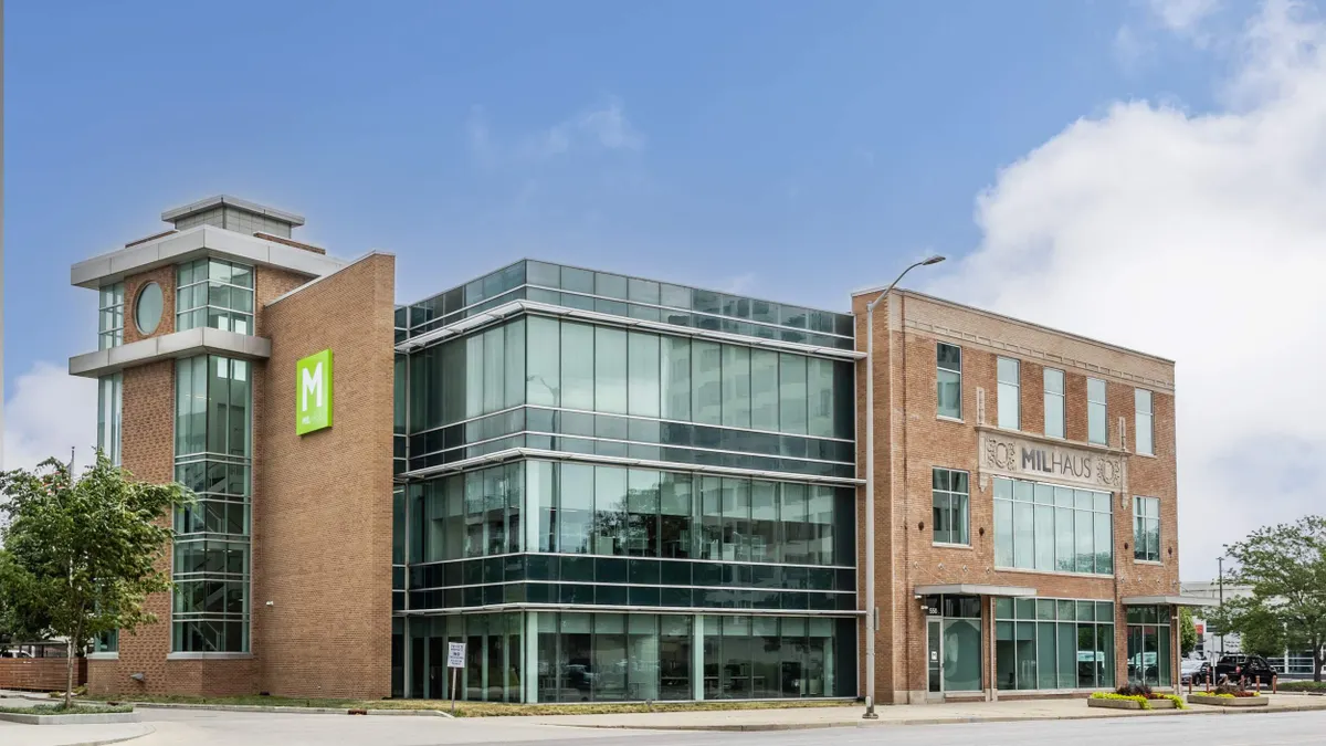 Picture of a brick building with an M logo