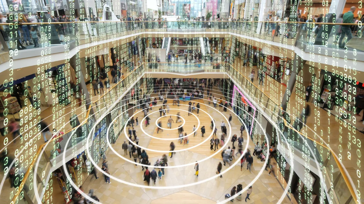 Phone sending out a signal in a matrix styled shopping mall.