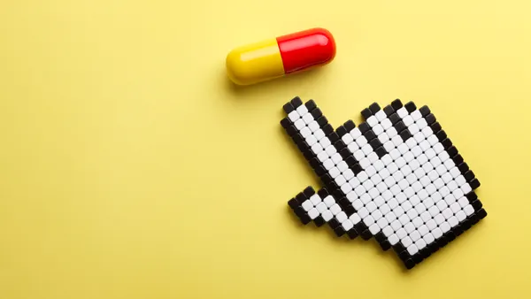 Capsule with hand cursor on yellow background