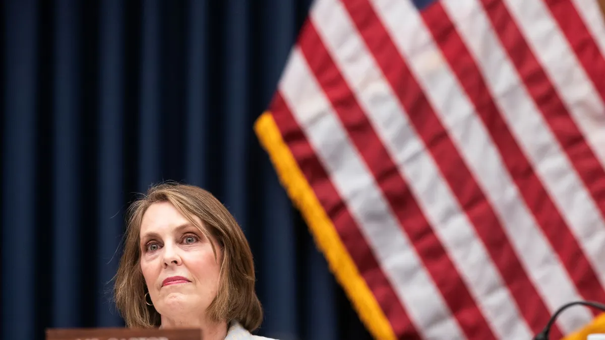 Democratic Rep. Kathy Castor sits in the Capitol with a flag behind her.