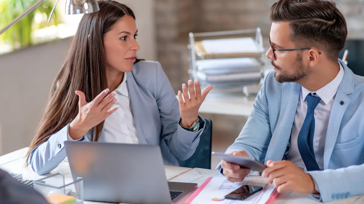 Business colleagues talking in the office