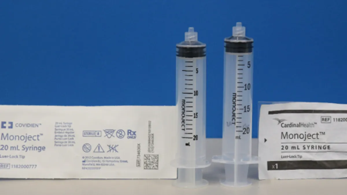 Two syringes are compared side by side. The one on the left is slightly shorter than the one on the right.