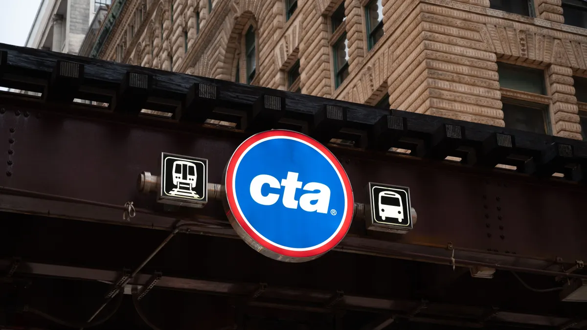 A street sign of Chicago Transit Authority hanging over a bridge