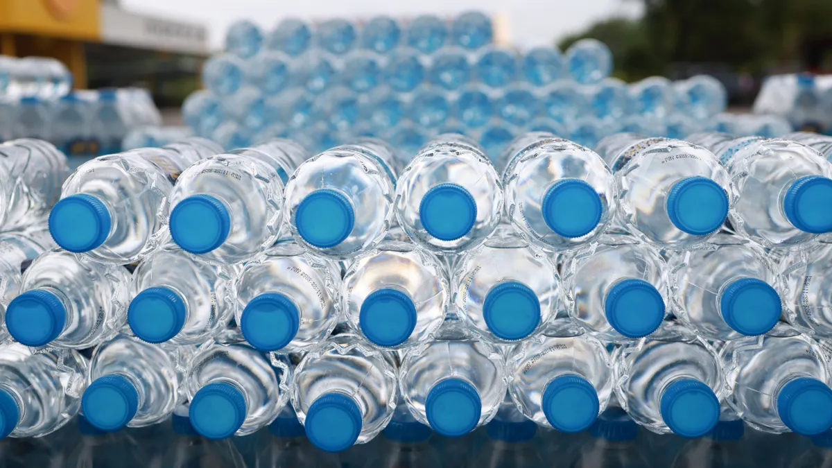 A close-up view of stacked PET water bottles.
