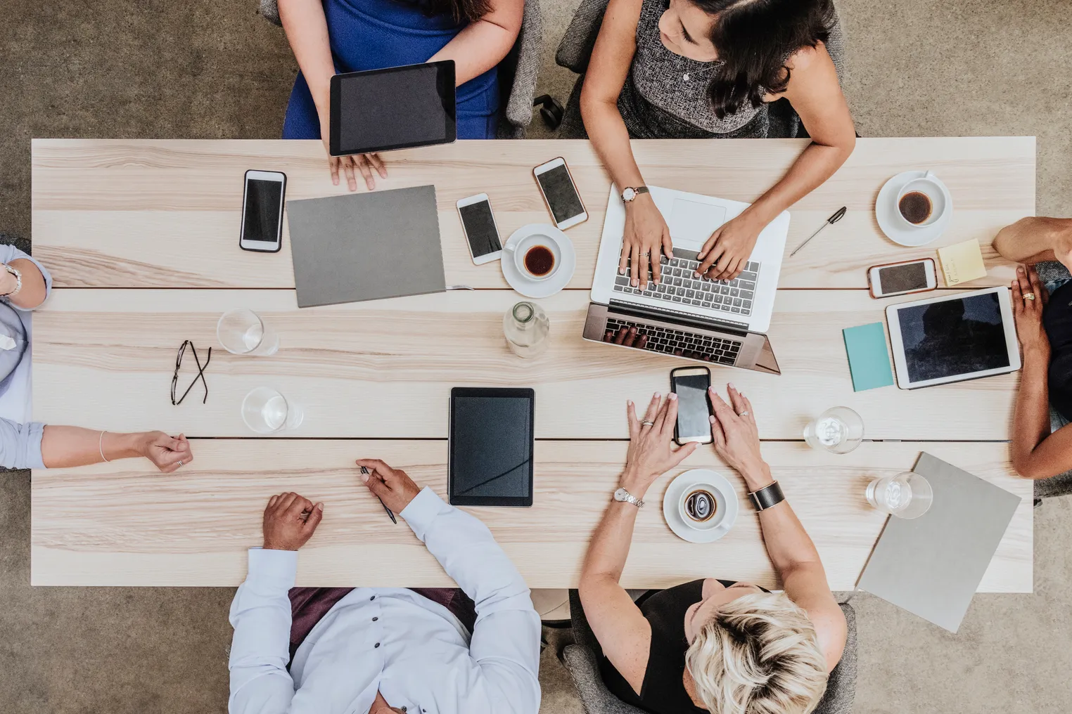 Group of people in meeting around boardroom table