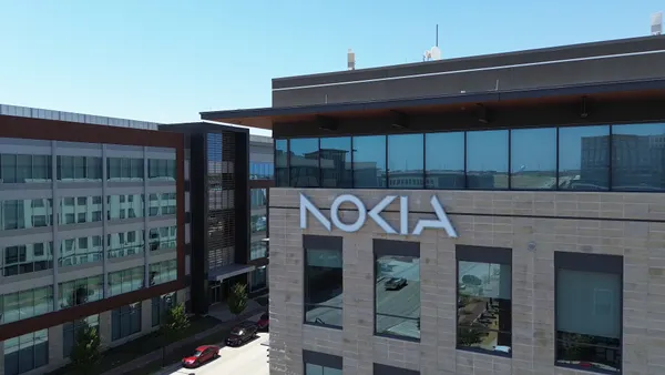 White Nokia logo text on the corner side of a building.