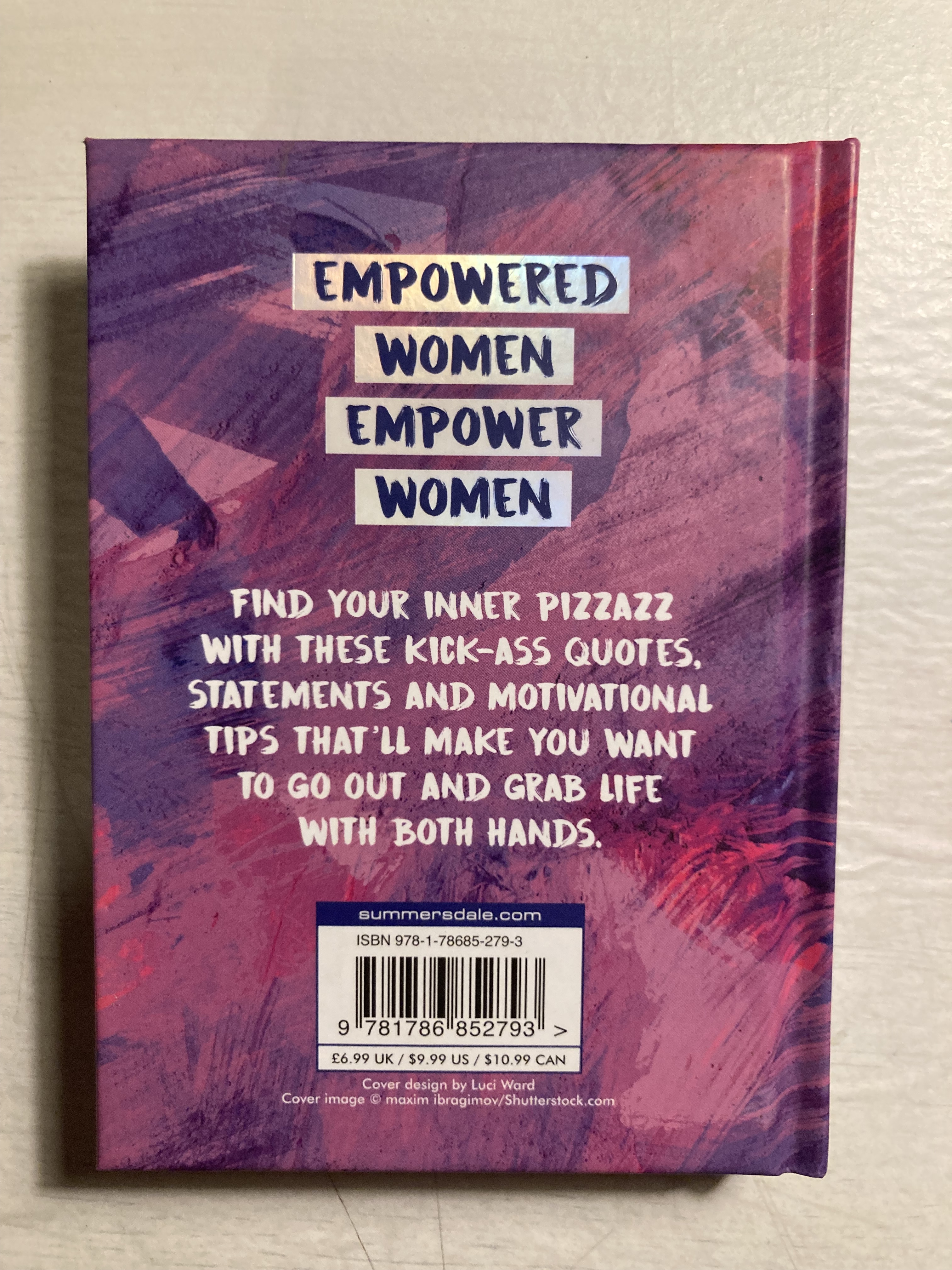 The book reads: "Empowered women empower women. Find your inner pizzazz with these kick-ass quotes, statements and motivational tips that'll make you want to go out and grab life with both hands."