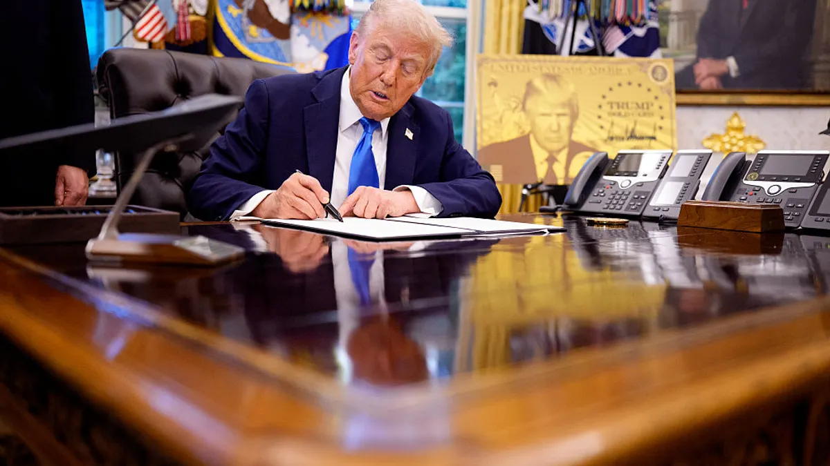 Trump signs H-1B executive order in Oval Office