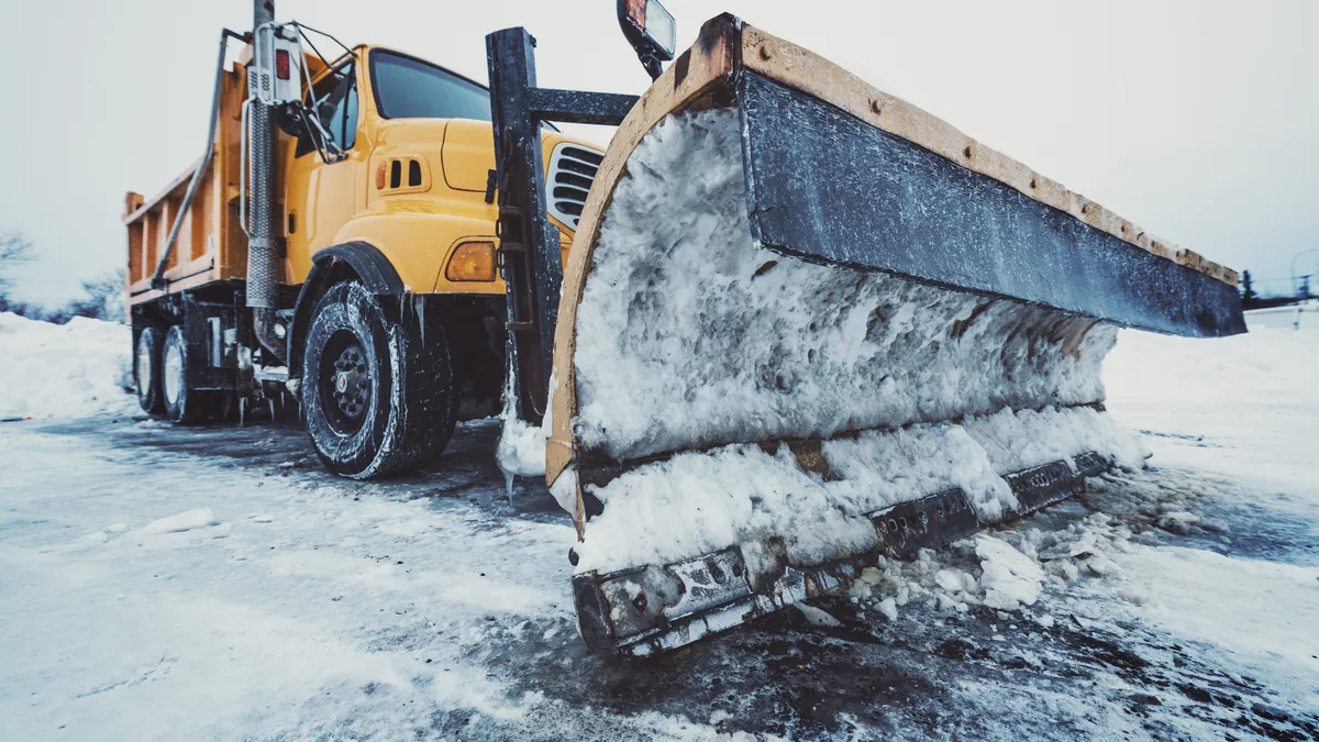 Tandem dump truck/snow plow ready for the next major snowfall. Mild cross processing.