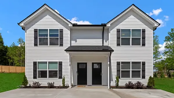 Tan single-family house.