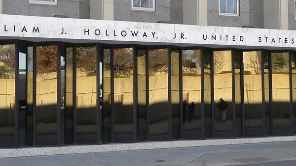 The facade of a court building with reflective glass