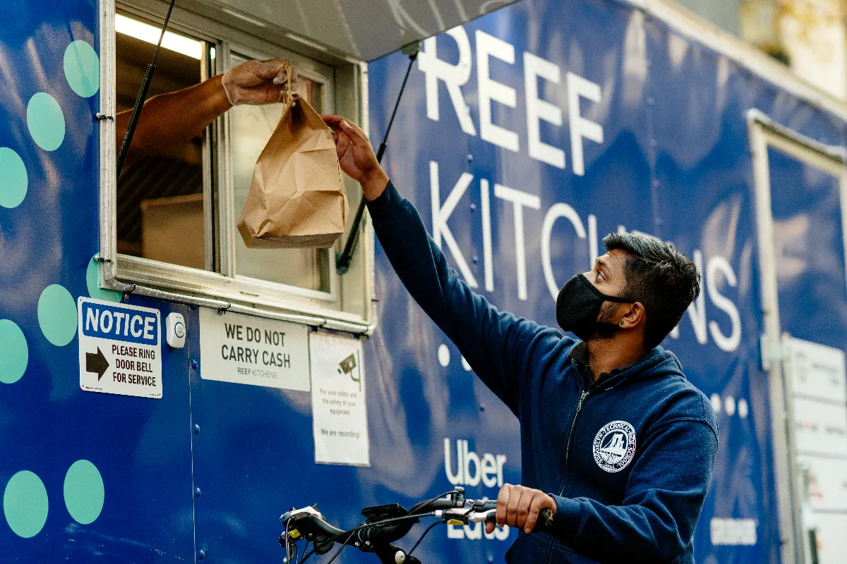 A man picks up an order from a Reef vessel. Photo by KATELYN PERRY