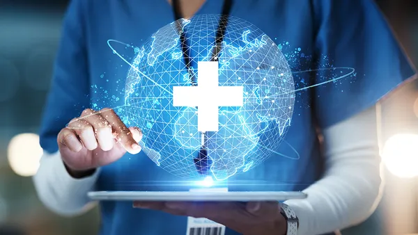 Hands on tablet with global network