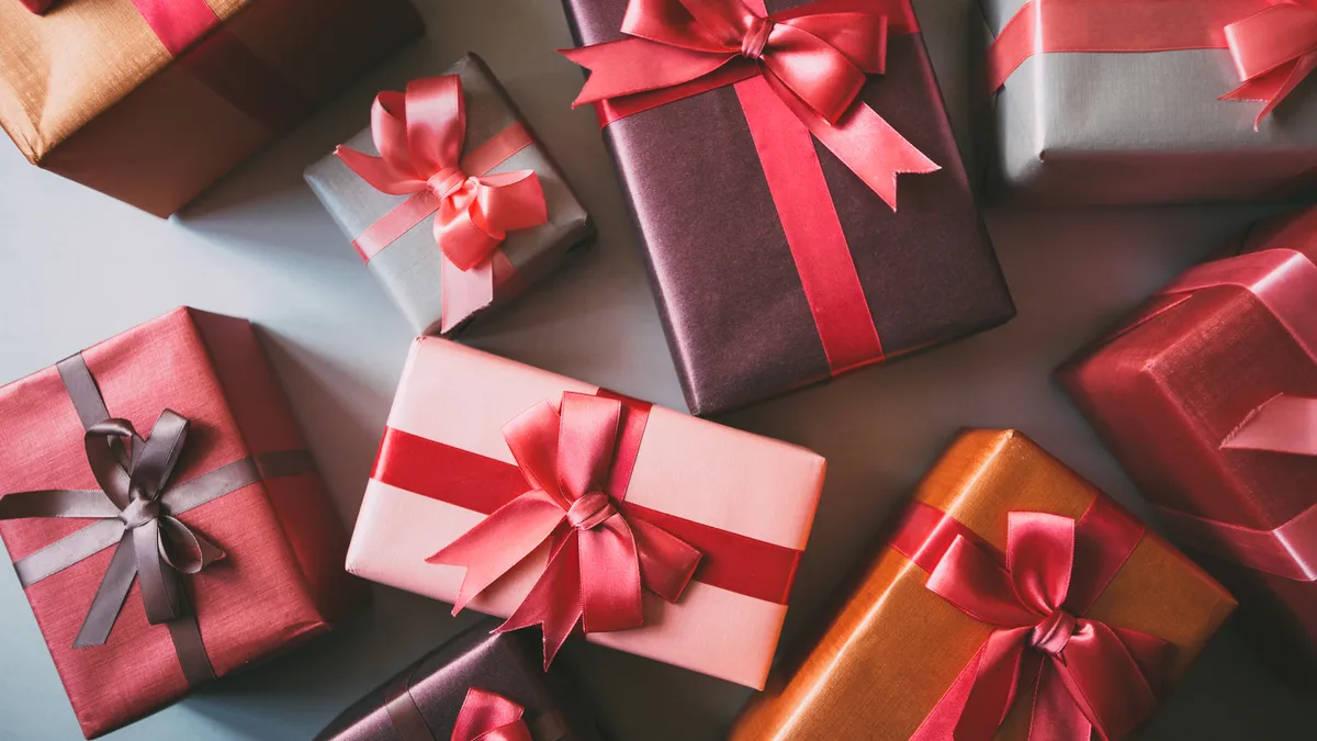 Overhead view of multicolored wrapping paper and ribbons