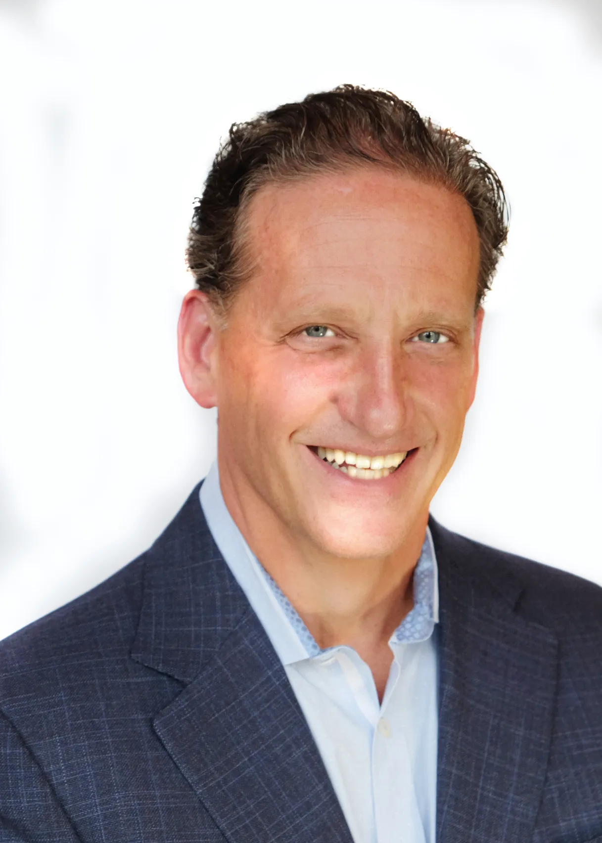 A man in a suit jacket smiles at the camera. He is Kevin Vasconi, Papa John&#x27;s chief technology and digital officer