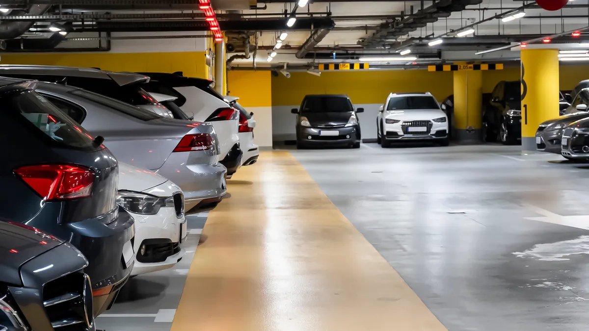 A parking garage with cars.