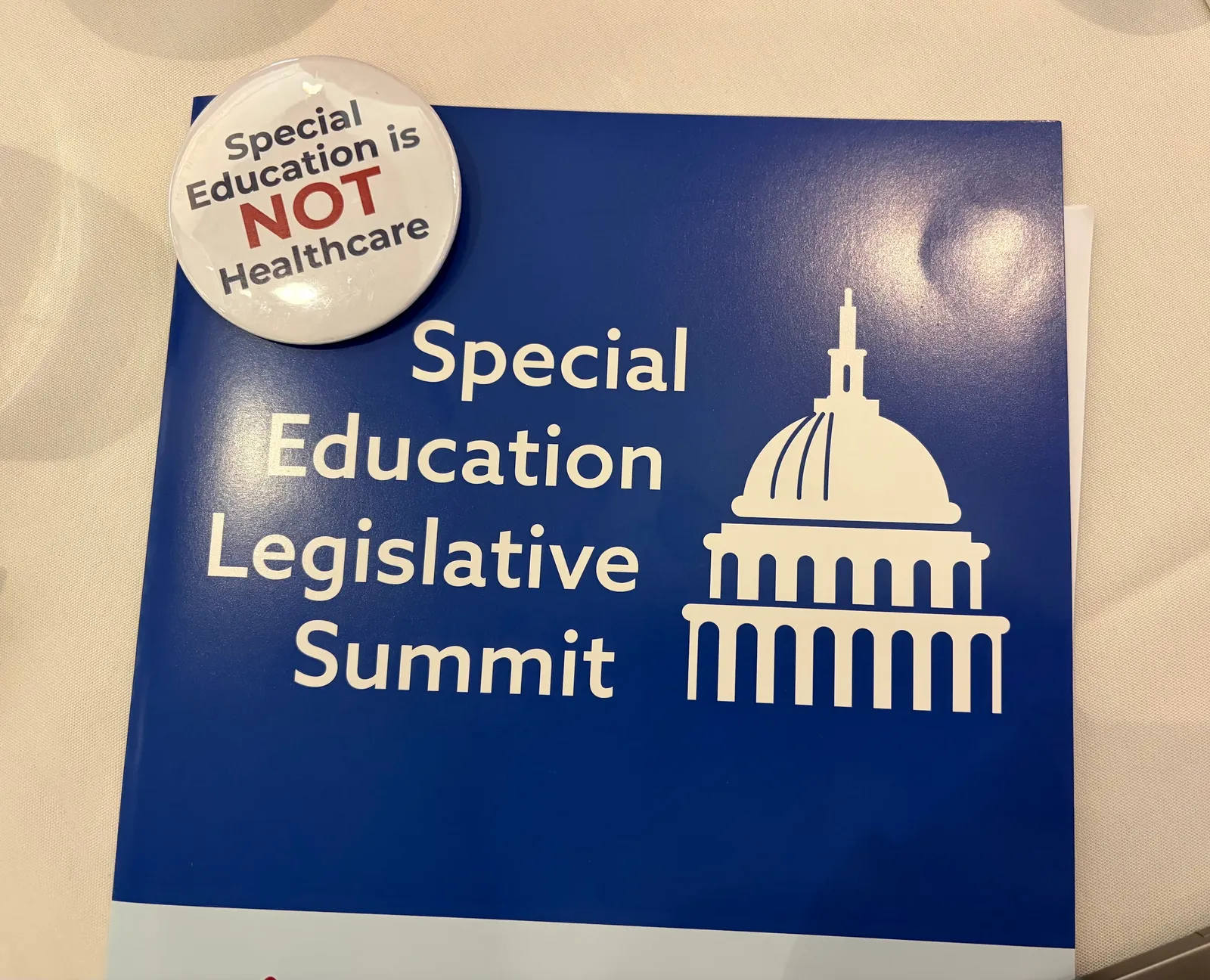 A folder and pin reading Special Education is NOT healthcare