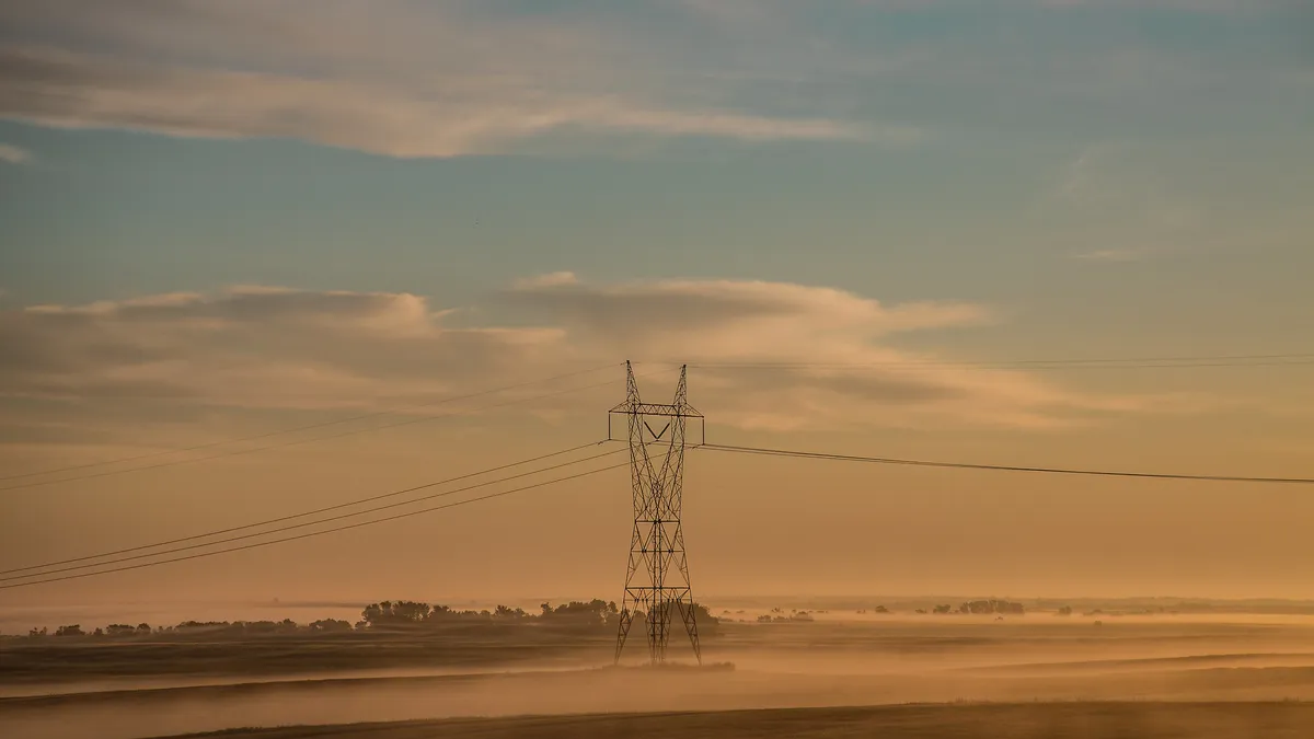 Foggy rural farms with power/electricity lines/cables along US Route 12 between Mobridge and Selby, South Dakota.