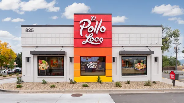 An image of a building with red and orange signage. The sign says El Pollo Loco.