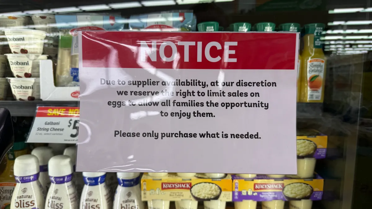 A sign about limited egg supply at a grocery store.