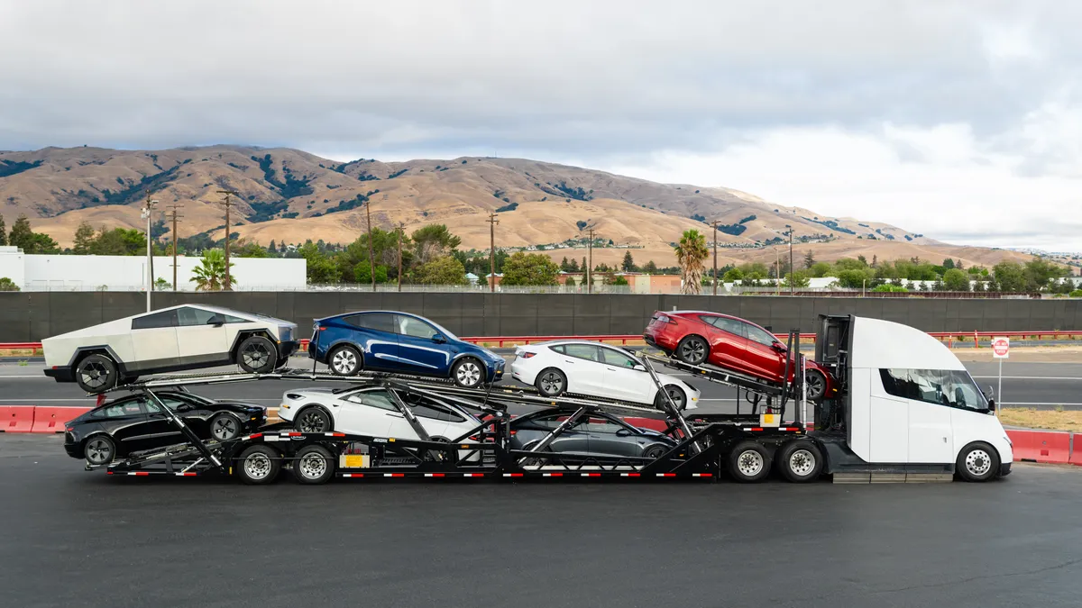 A truck carrying Tesla's vehicles for delivery.