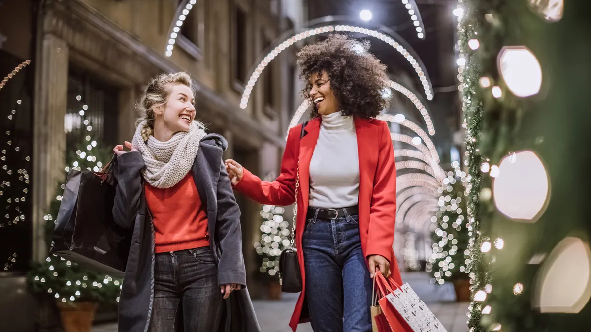 Two Attractive Young Women In Christmas Shopping