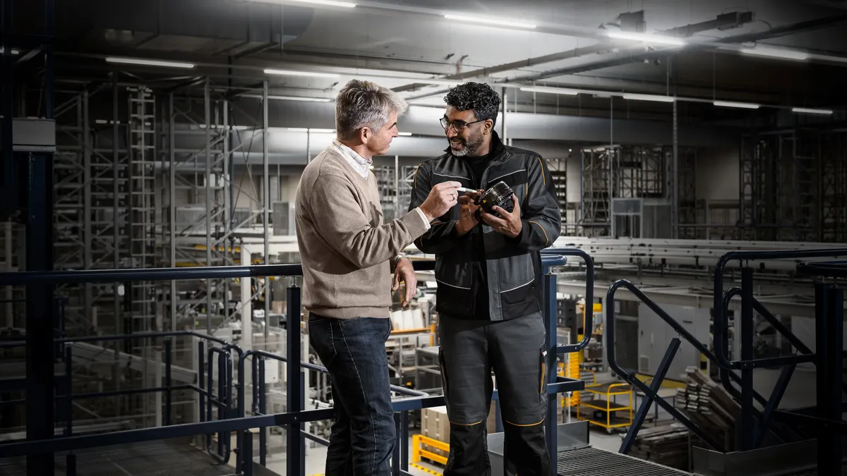 Two people talking in the warehouse