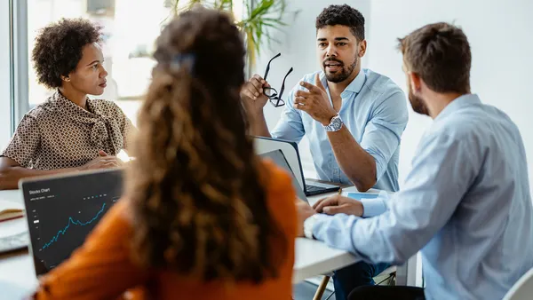 Colleagues in a team meeting at the office