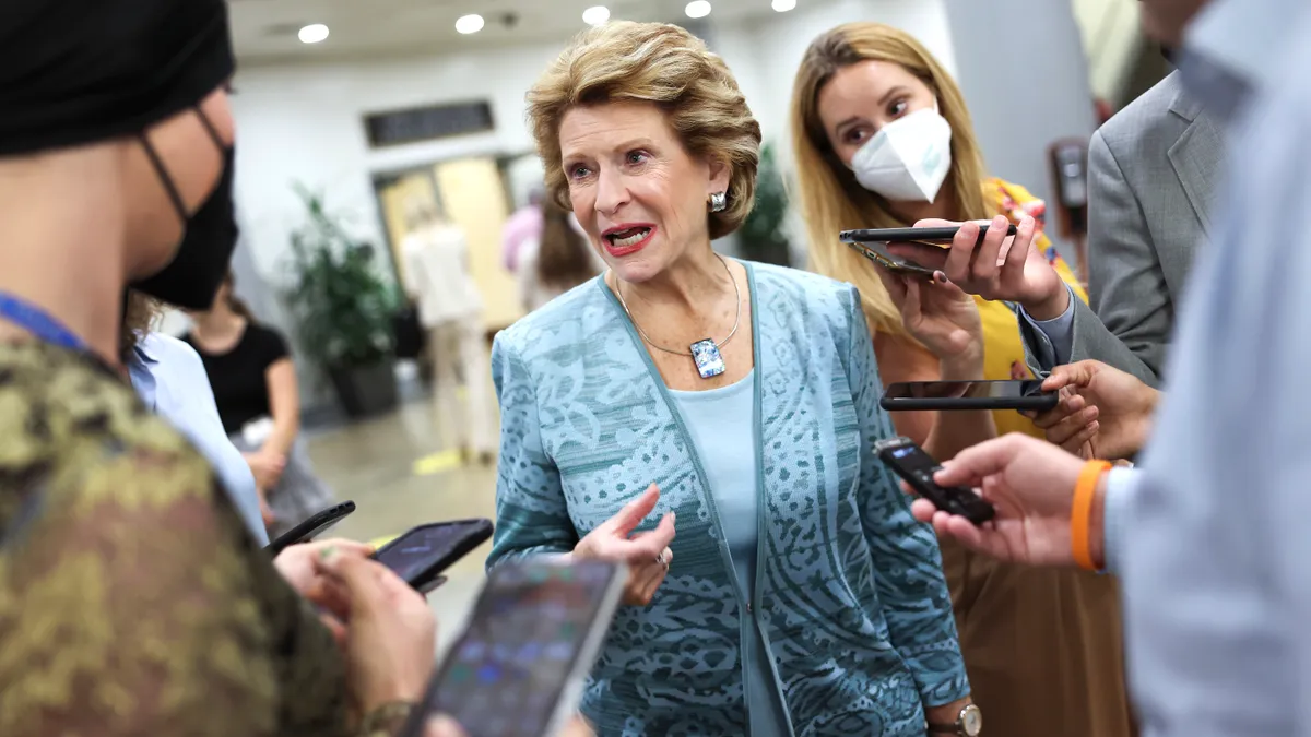 Sen. Debbie Stabenow speaks to a group of reporters.