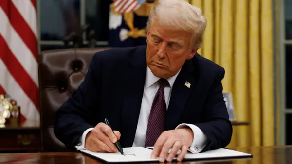 President Donald Trump signs an executive order in the Oval Office in Washington, D.C., on Jan. 20, 2025.