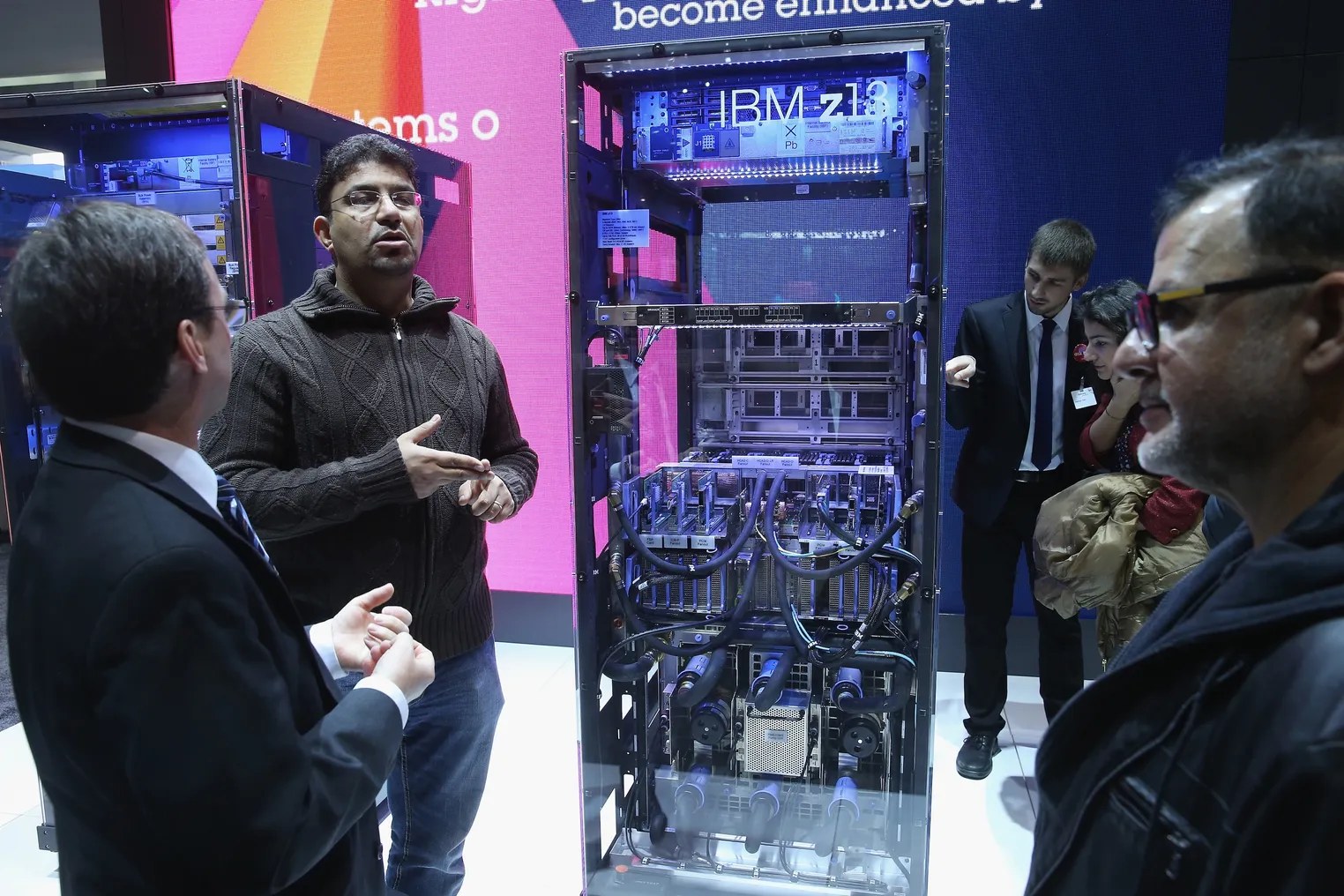 Visitors look at an IBM z13 mainframe computer at the IBM stand at the 2015 CeBIT technology trade fair on March 16, 2015 in Hanover, Germany.